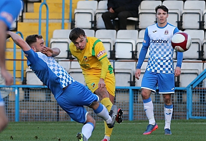 FA Trophy - Second-half action - Sean Cooke crosses the ball under pressure (1)