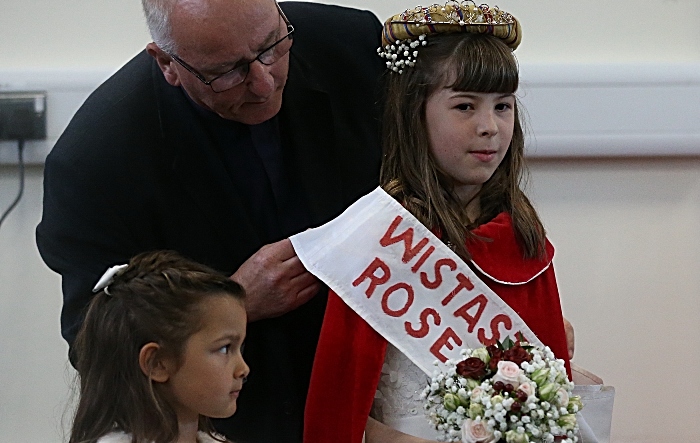 St. Mary's Wistaston Rector Mike Turnbull places the sash on Wistaston Rose Queen Charlotte Shaw (1)