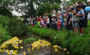 Villagers enjoy annual duck race in Wistaston