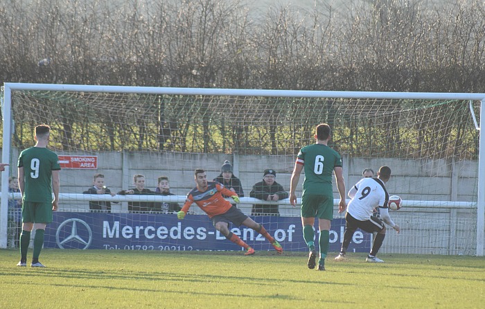 Stefan Moore scores the penalty for Corby Town