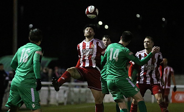 Stourbridge attempt to head forward the ball