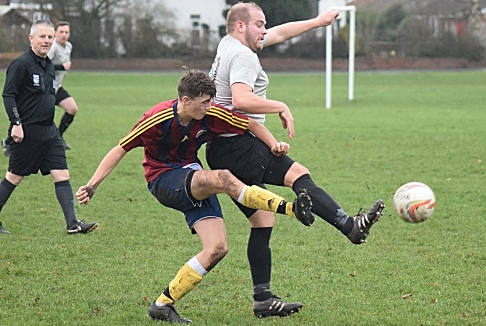 Talbot and Salvador players challenge for the ball (1)