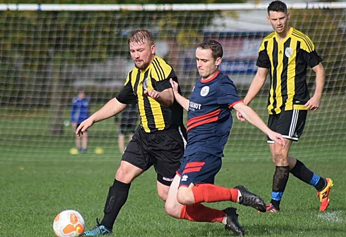 Talbot player prepares to tackle ball from AFC Talbot (1)