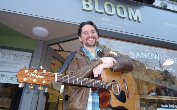 Tim Lee poses outside Bloom following his performance Words and Music Festival