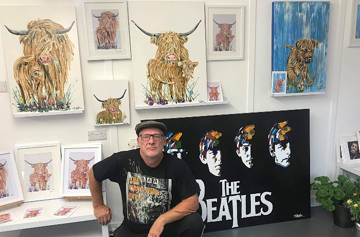 Tony Denton with a selection of his artwork at The Marina Gallery