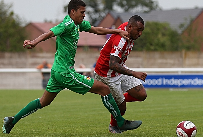 Troy Bourne defends the ball from a Stourbridge player (1)