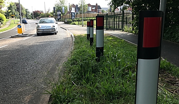 Verge marker posts facing the wrong way (red side) and splitter island at Wistaston Hall Bridge on Church Lane in Wistaston (1)