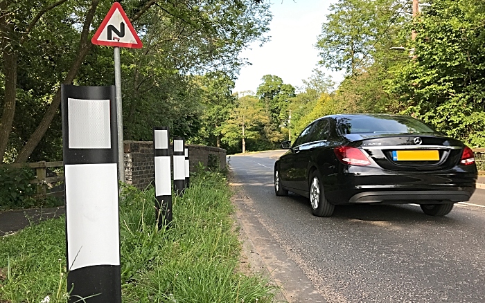 Verge marker posts facing the wrong way (white reverse side) as traffic heads into Crewe at Wistaston Hall Bridge on Church Lane in Wistaston (1)
