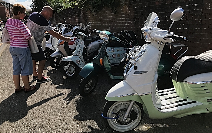 Visitors enjoy viewing the scooter
