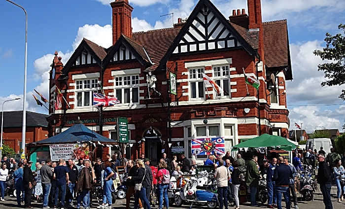 Visitors, scooter owners and their scooters at the front of The Railway Hotel in the sunshine (1)