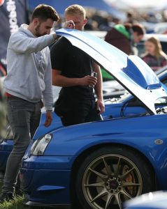 RallyFest - Visitors inspect a Subaru sports car