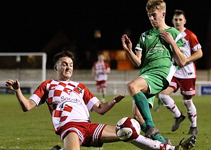 Winnington Avenue 94 player goes in with a heavy tackle (1)