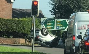 Police probe crash which left car on roof near Nantwich