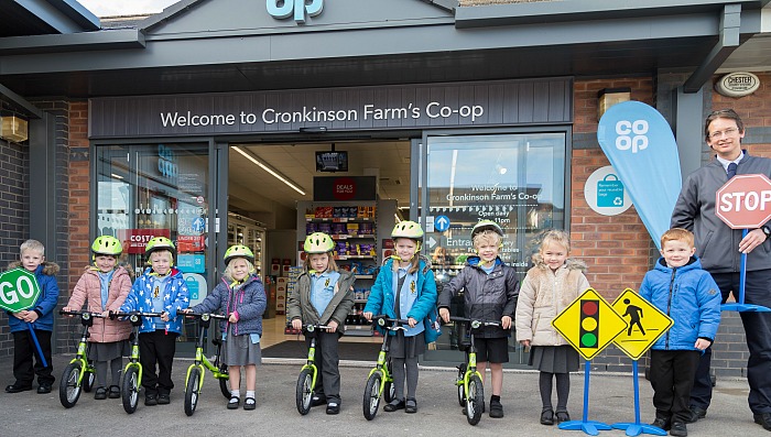 bikes - co-op-manager-with-pear-tree-pupils-and-bikes