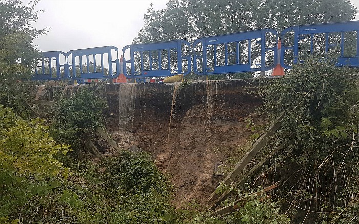 flood damage to A530 caused by burst water main on Middlewich Road