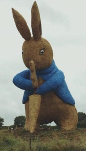 full length peter rabbit straw statue