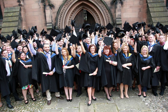 graduates celebrate outside St Mary's Church