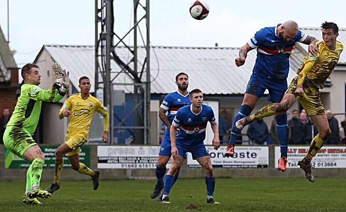 header by malkin against whitby town