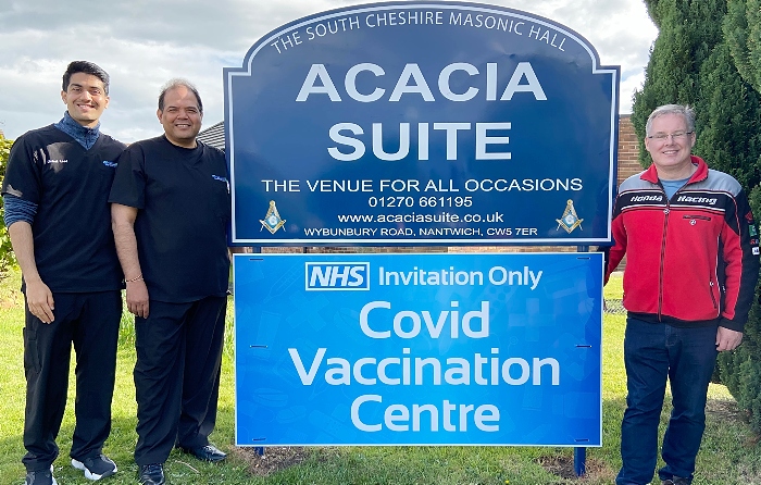 l-r Jainil Patel - Raj Patel MBE - Roger Morris by Acacia Suite (Masonic Hall Willaston) Covid Vaccination Centre signage (1)