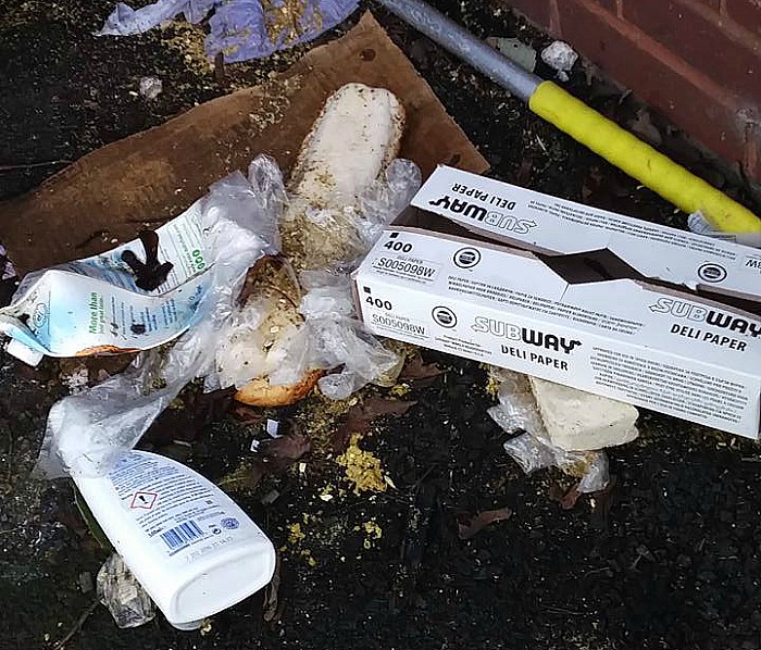 litter spilling out of swine market bins