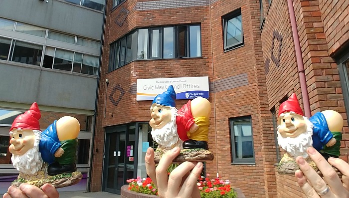 mooning gnomes protest outside council offices