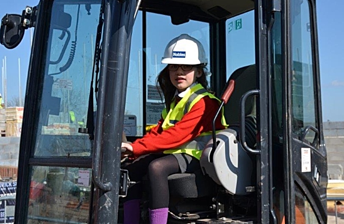 pupils playing on diggers at time capsule tesni event