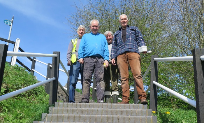 rotary and civic society volunteers paint aqueduct steps