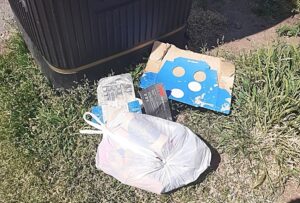 waste dumped by litter bins in nantwich